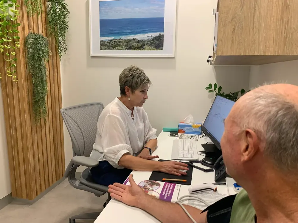 Older patient talking with a GP